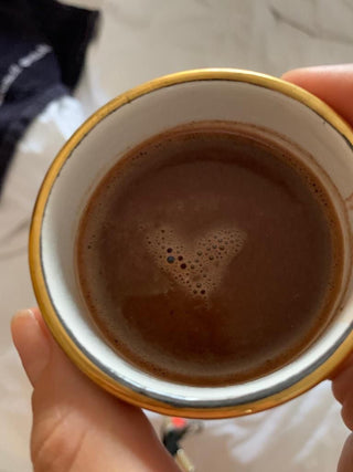 Cacao in cup with small foam heart