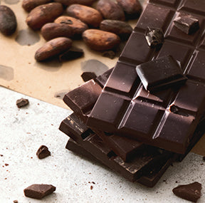 Dark chocolate bar with cocoa beans 