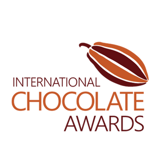 Logo of the International Chocolate Awards with a cocoa bean illustration on a white background.
