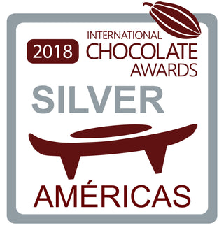 2018 International Chocolate Awards Silver Americas logo with chocolate bean and award shape.